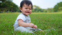 Asian Baby Smile in Park - Dot Orthodontic