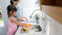 Mom and Daughter Cleaning Dishes - Sabun Cuci Botol Bayi