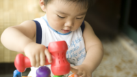 Asian Baby Playing With Toys - Sabun Cuci Botol Bayi